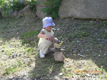 Suzie, creating her painter rock sculpture